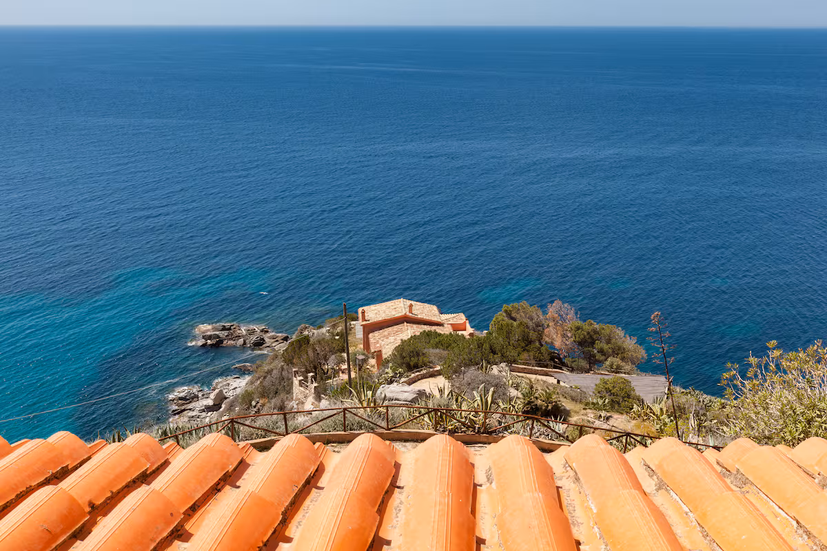 The view from the upper terrace over the coastline below