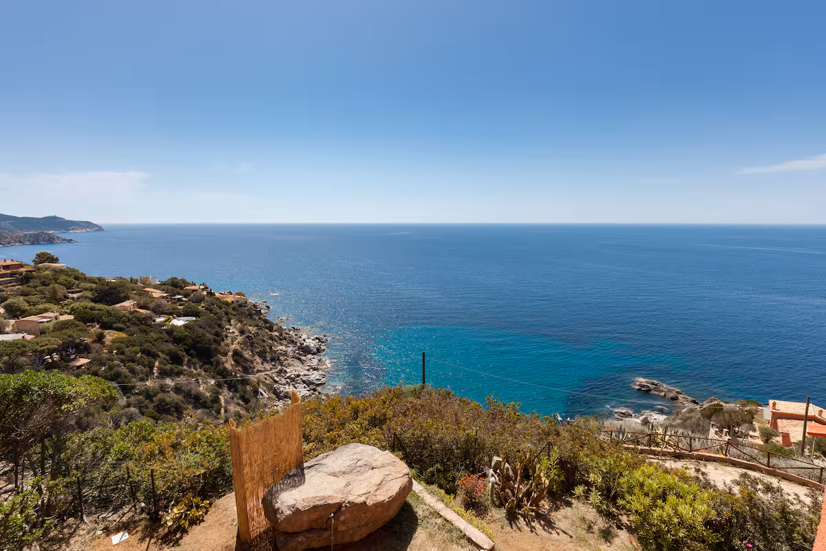 A panoramic view over the turquoise cove below