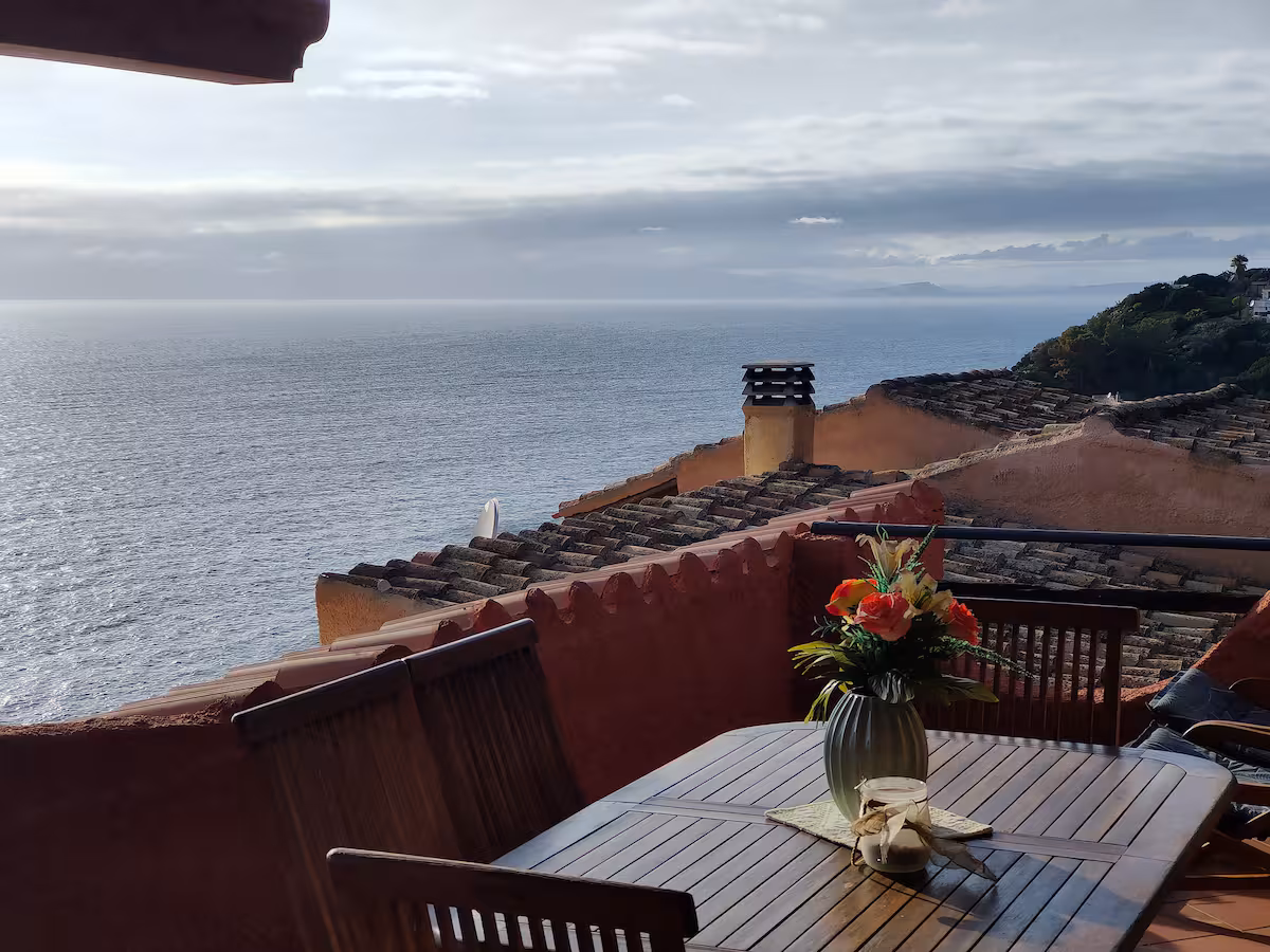 Morning coffee on the terrace, above the rooftops and the open sea